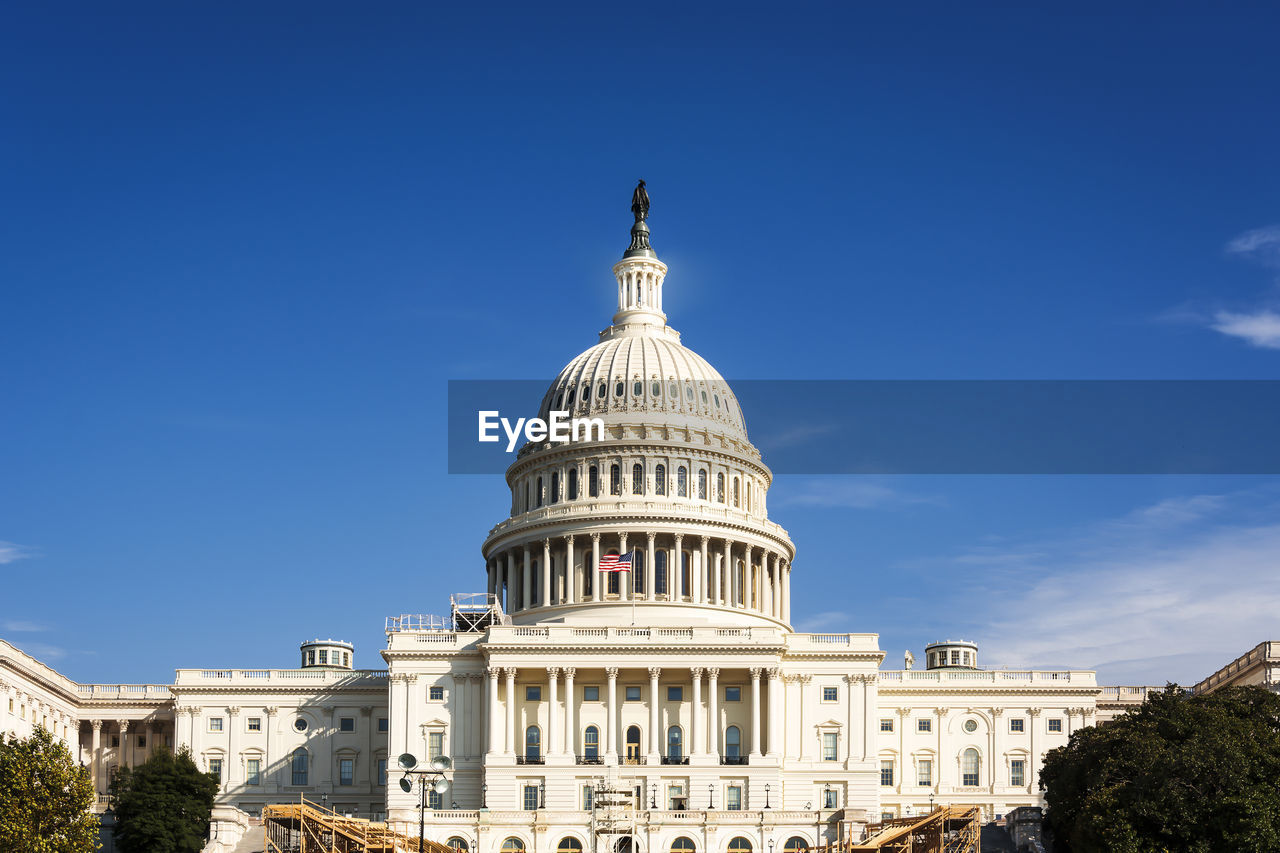 Facade of the united states congress on capitol hill, washington dc on a sunny day