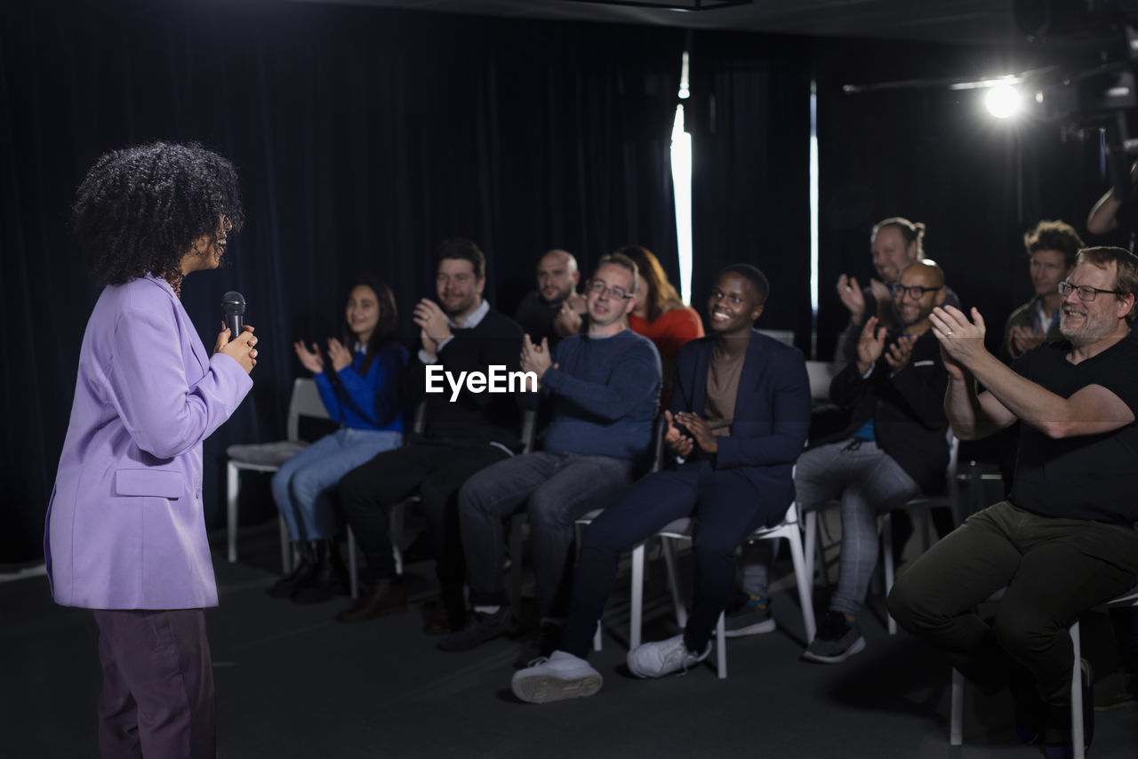 Audience applauding tv show host