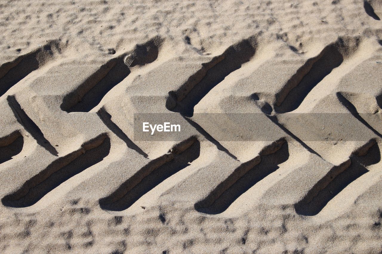 High angle view of shadow on sand