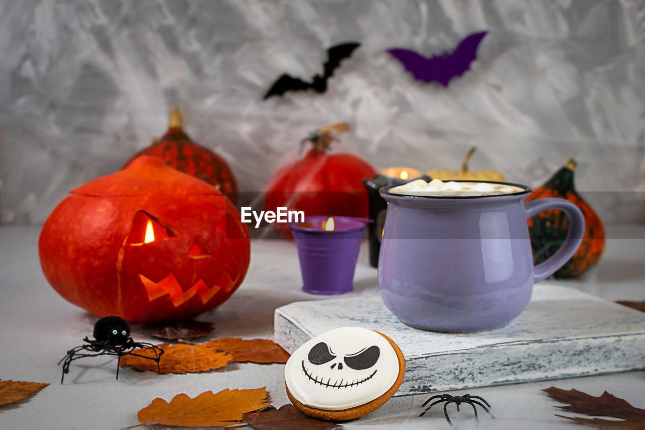 food and drink, food, halloween, pumpkin, celebration, autumn, squash, no people, jack-o'-lantern, vegetable, still life, indoors, table, tradition, holiday, healthy eating, nature, teapot, craft, sweet food, cup