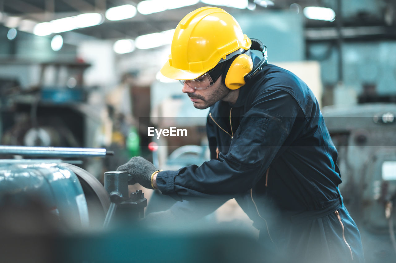 MAN WORKING ON FACTORY