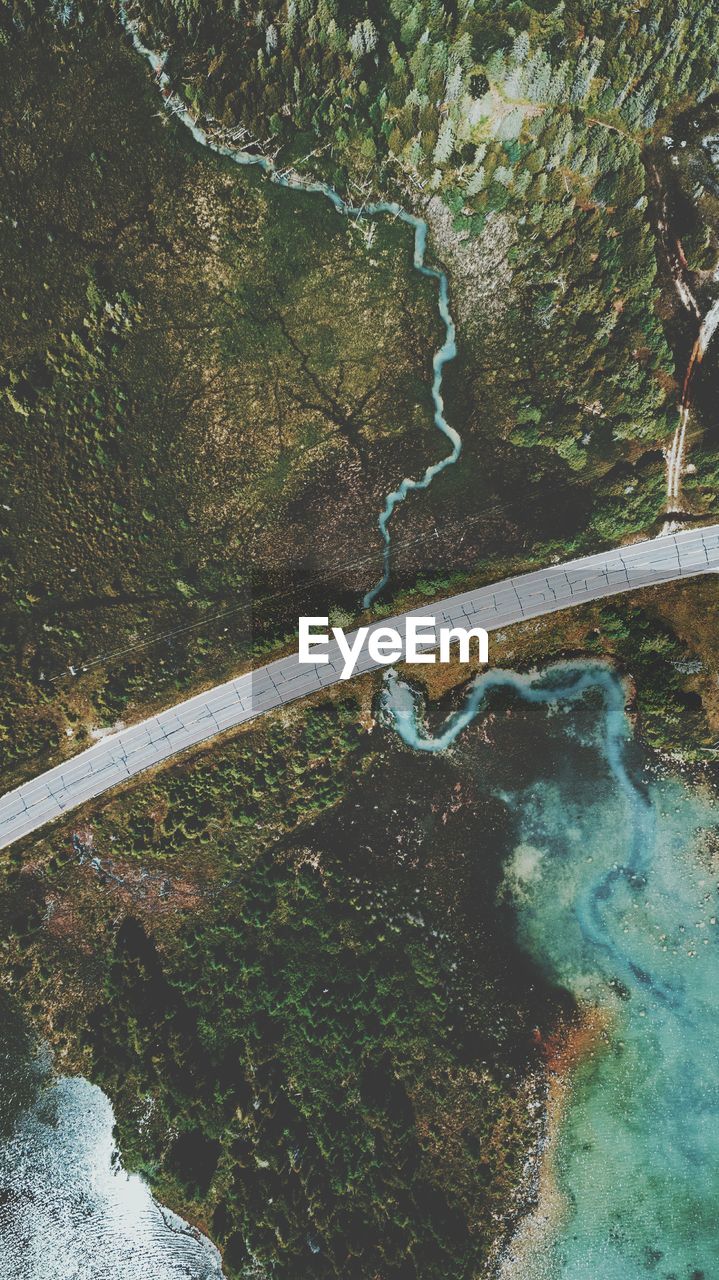 Aerial view of road amidst river