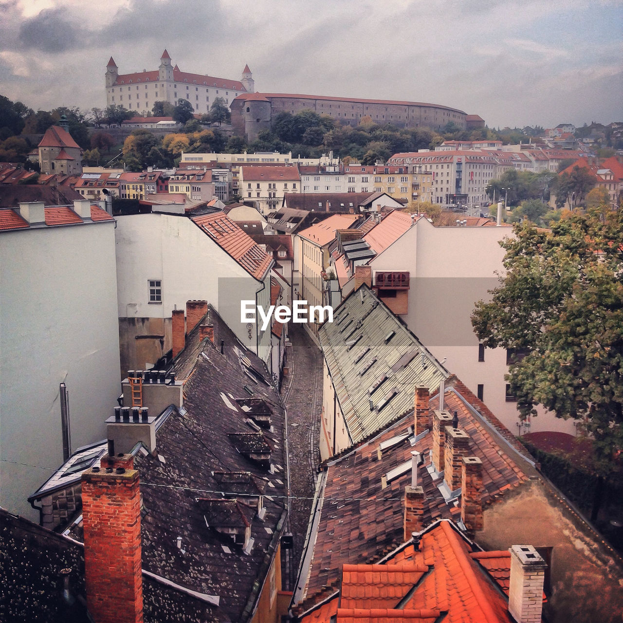 Mid distance view of bratislava castle with residential district in foreground