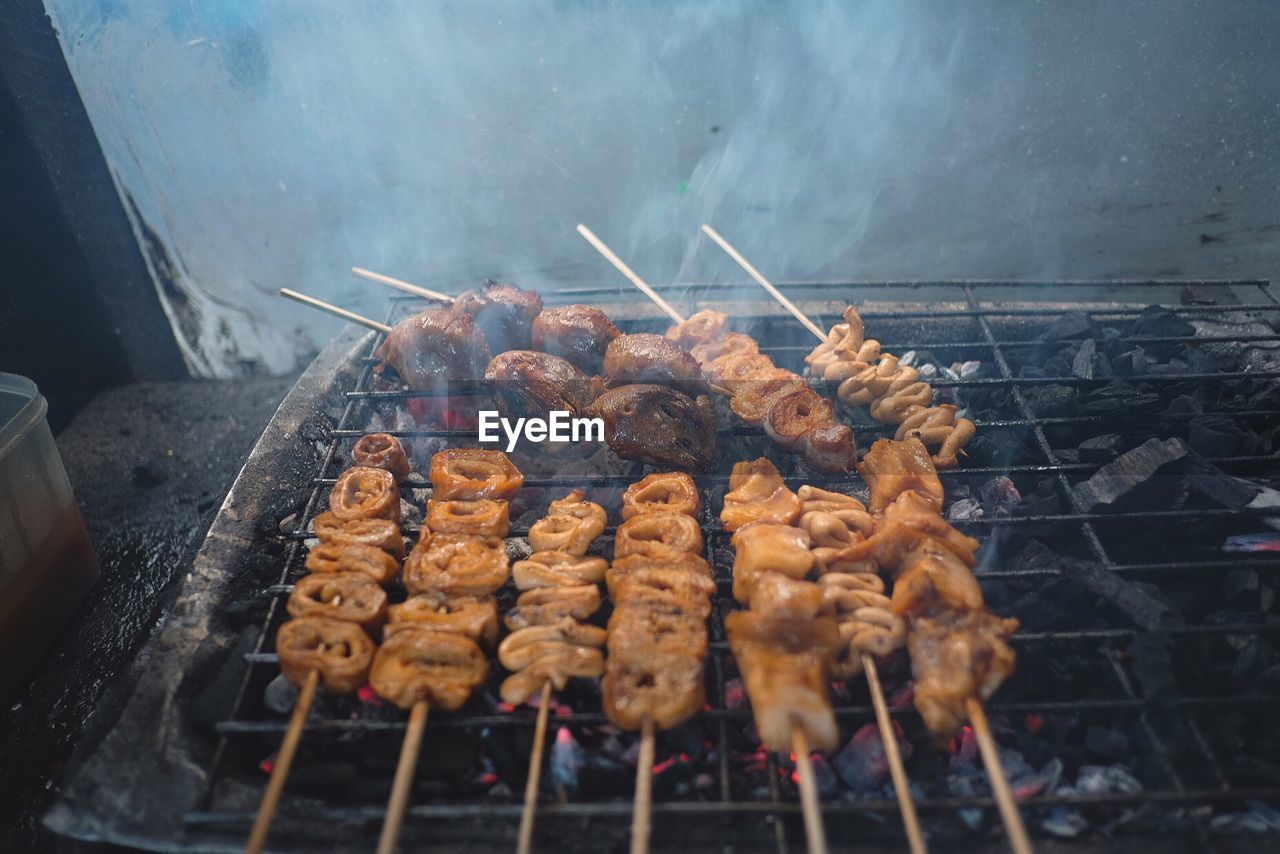 Close-up of meat on barbecue grill