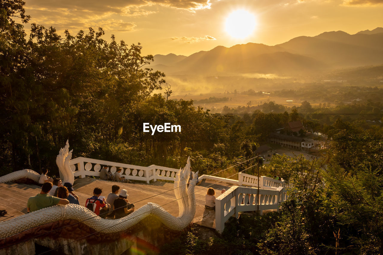 PEOPLE AT PARK DURING SUNSET