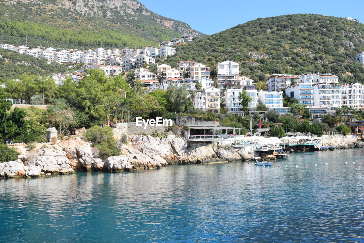 Town by sea and buildings in city