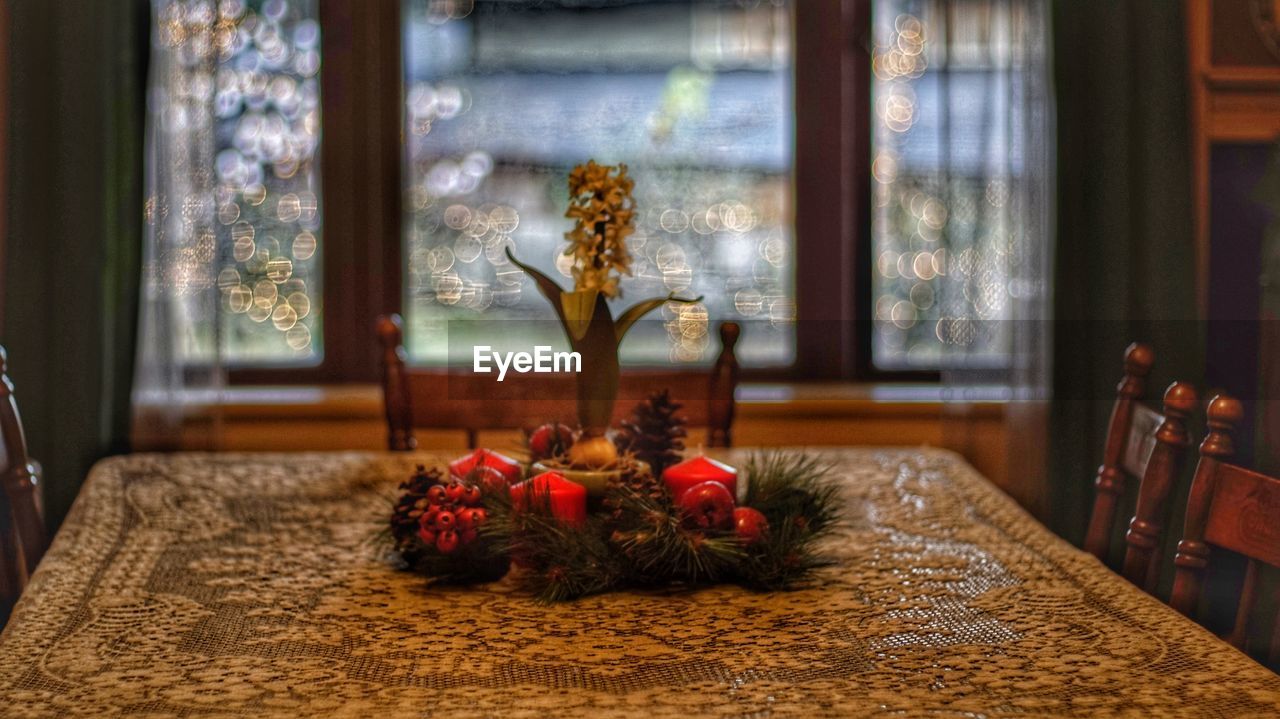 Close-up of christmas decorations on table at home