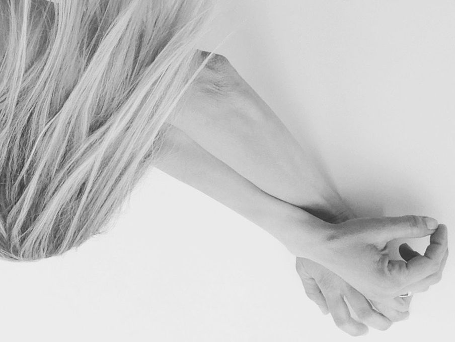 CLOSE-UP OF YOUNG WOMAN