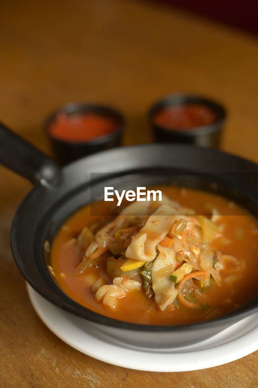 Close-up of  noodle soup in bowl on table