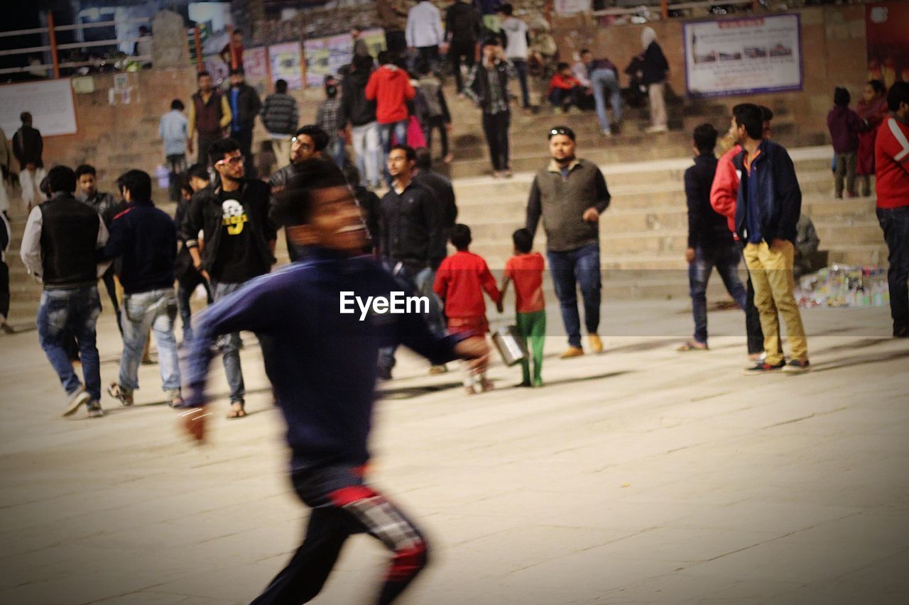 GROUP OF PEOPLE ON STREET