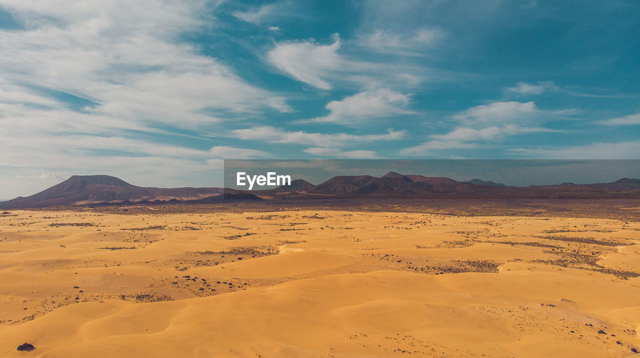 Scenic view of desert against sky