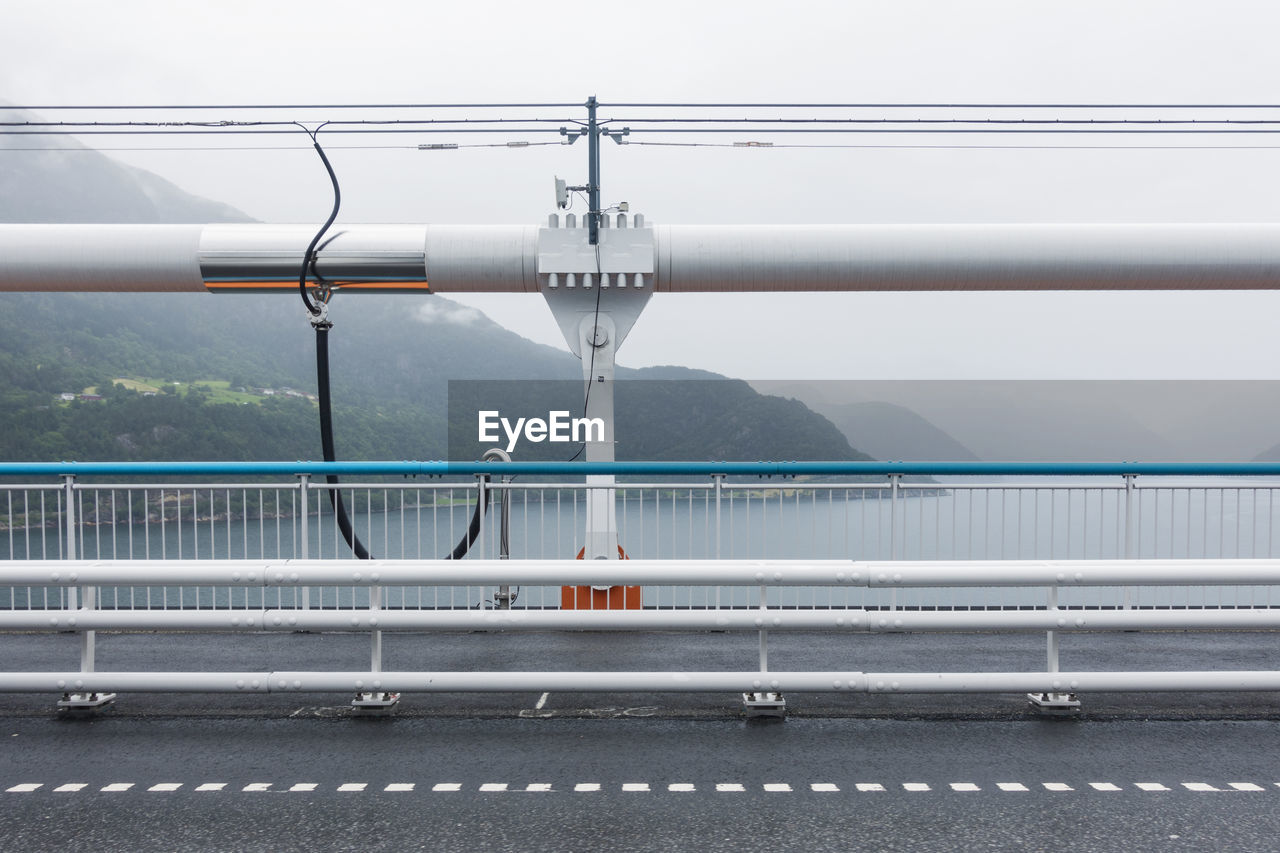 Cars on road against sky