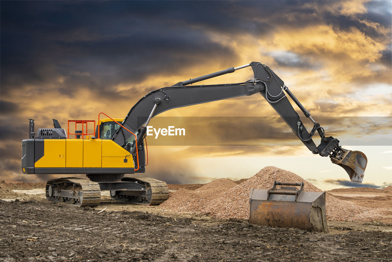 Heavy earth mover bulldozer working on construction site