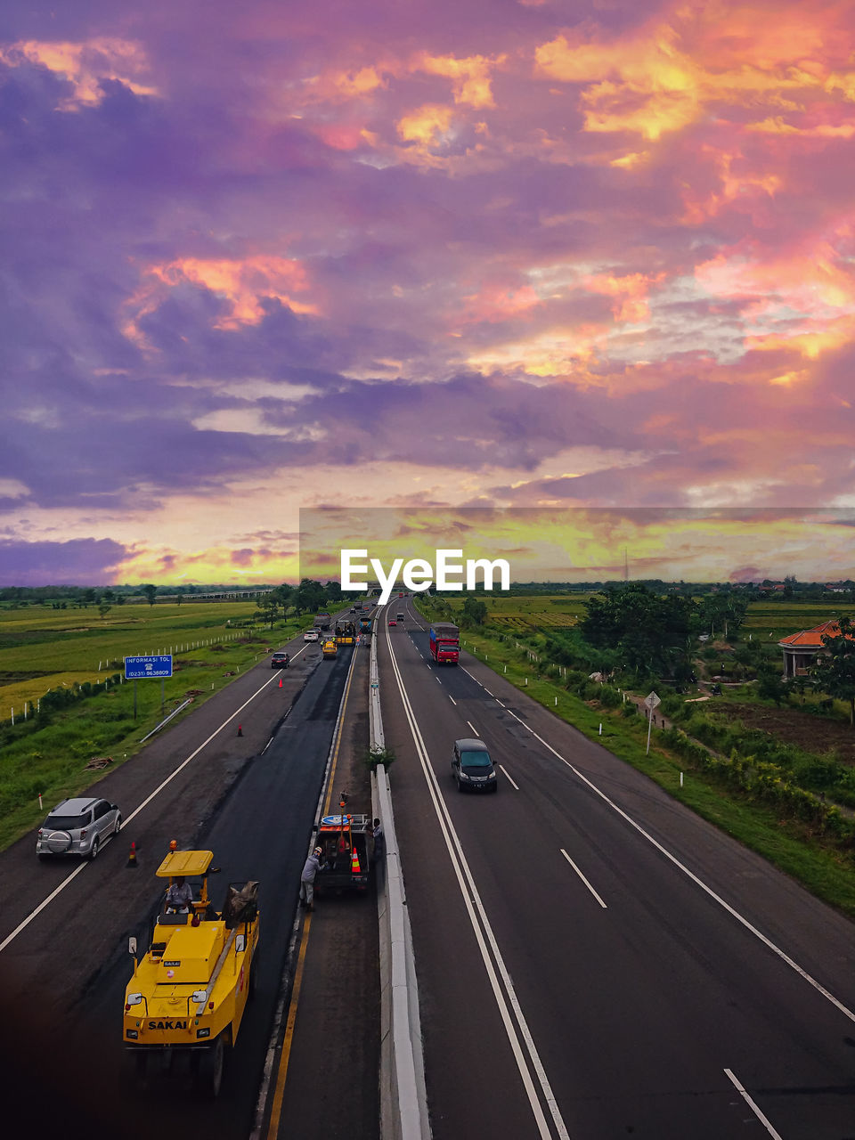 HIGH ANGLE VIEW OF HIGHWAY AT SUNSET