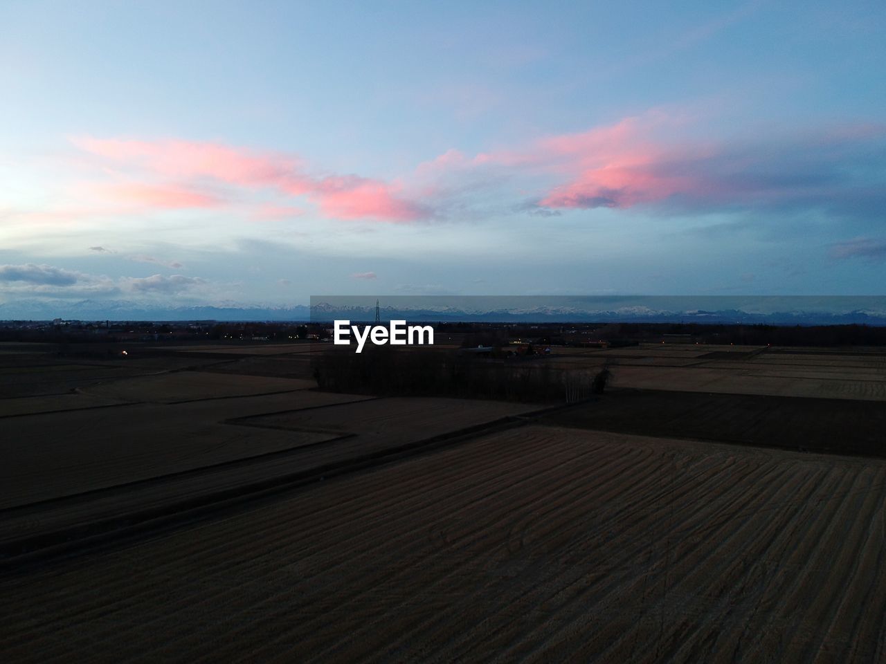 SCENIC VIEW OF LANDSCAPE AGAINST SKY DURING SUNSET