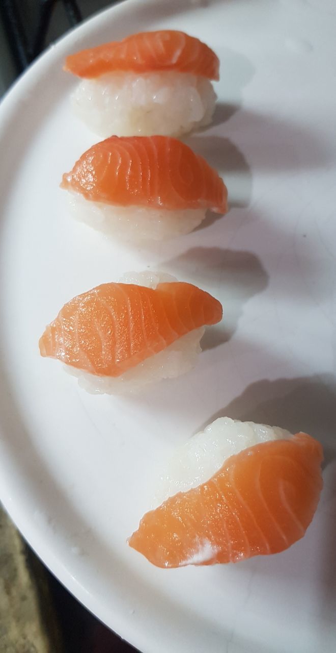 CLOSE-UP OF FISH SERVED ON PLATE