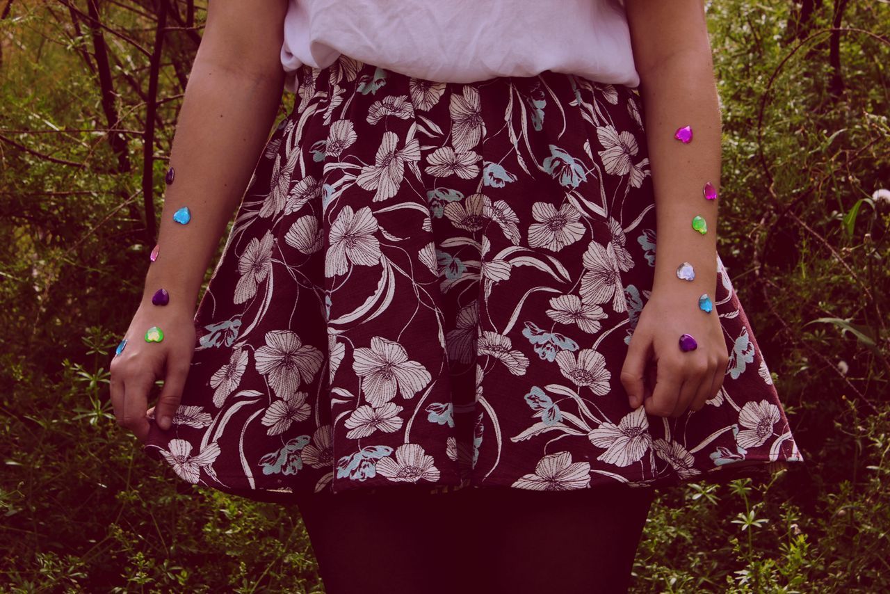 Close-up of woman with decorations on hand