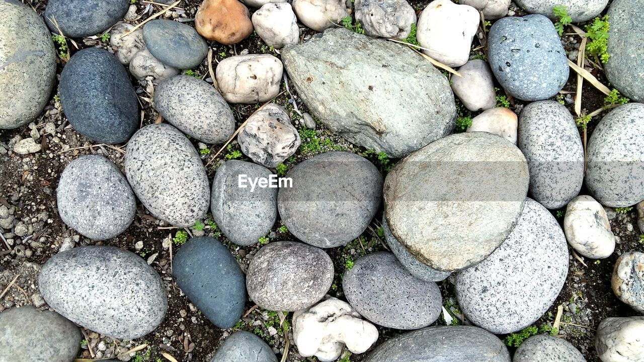 Directly above shot of stones on field