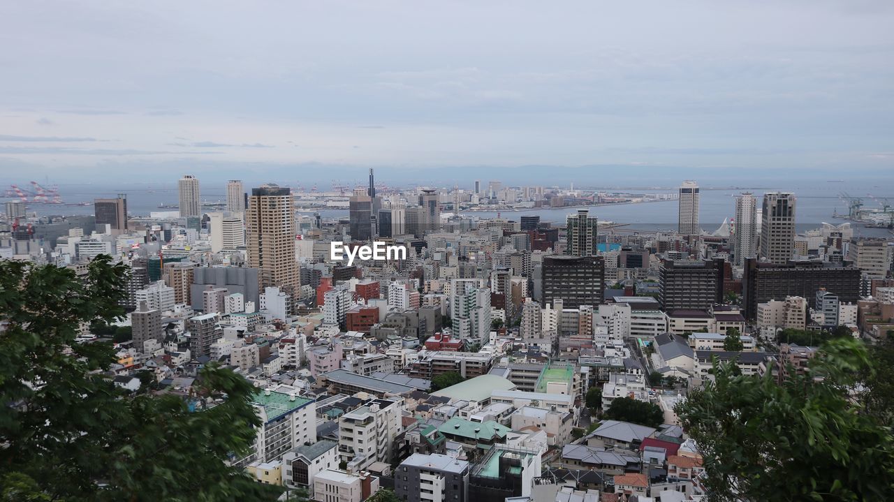 High angle view of buildings in city against sky