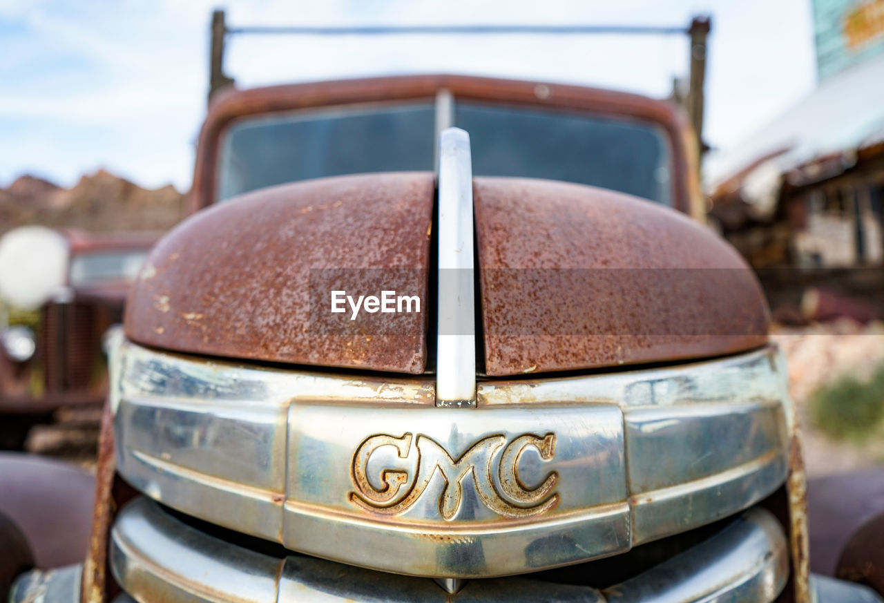 CLOSE-UP OF RUSTY CAR IN BOAT