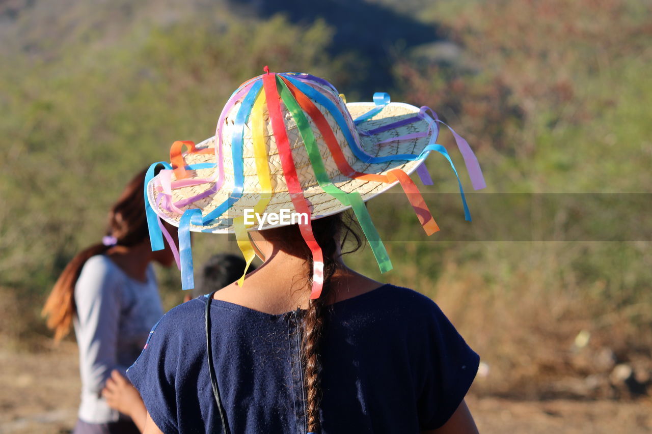 Rear view of woman wearing colorful hat