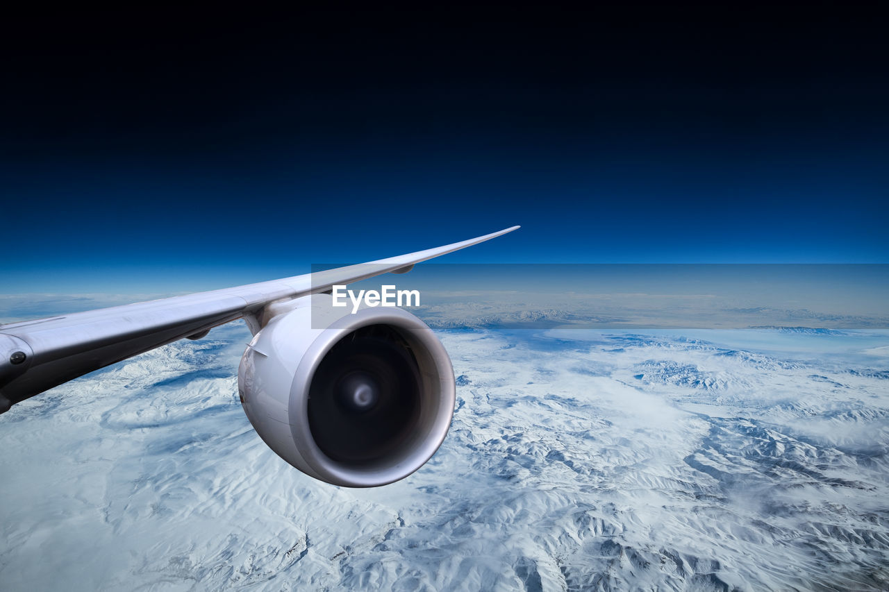 vehicle, air vehicle, airplane, transportation, flying, sky, aircraft wing, planet earth, aerial view, mode of transportation, space, screenshot, nature, jet engine, environment, travel, aircraft, aviation, technology, blue, cloud, engine, copy space, aerospace industry, air travel, aircraft engine, no people, horizon, outer space, outdoors, cloudscape