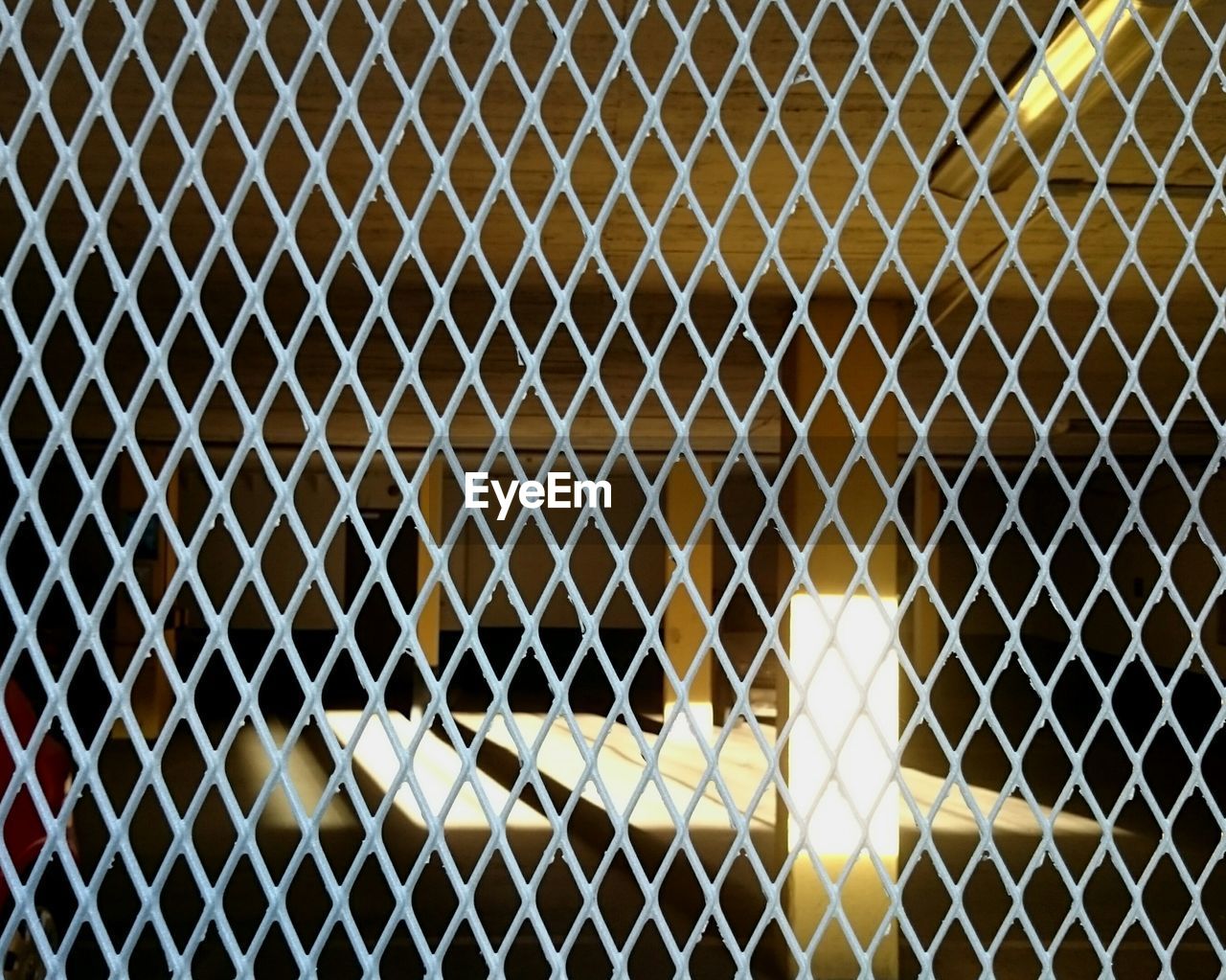 FULL FRAME SHOT OF CHAINLINK FENCE AT NIGHT