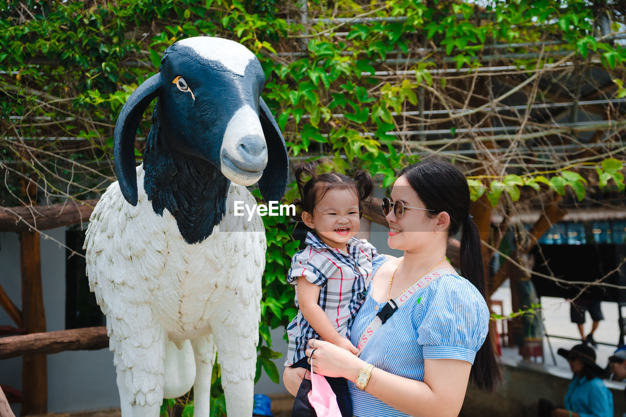 Portrait of mother and daughter outdoors