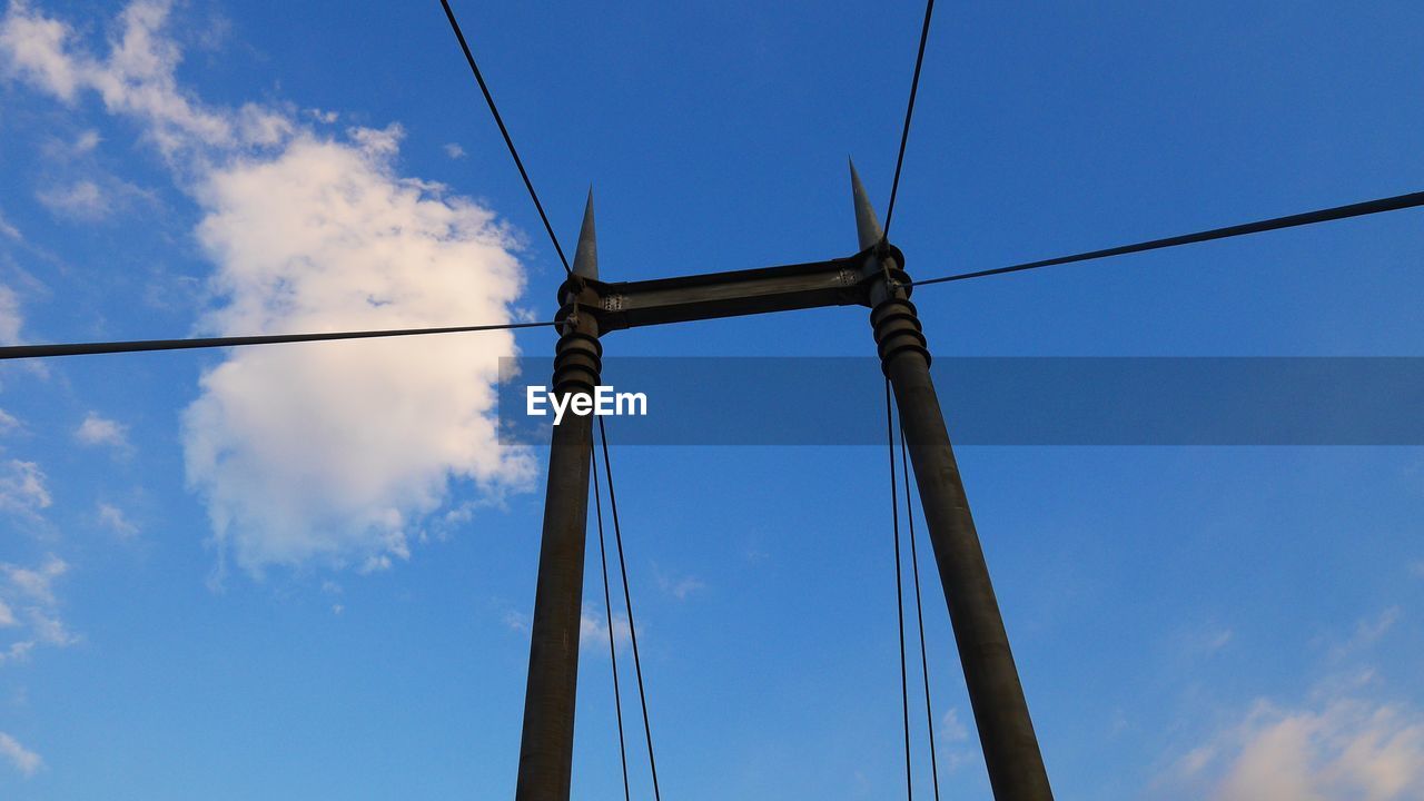 LOW ANGLE VIEW OF BRIDGE AGAINST BLUE SKY