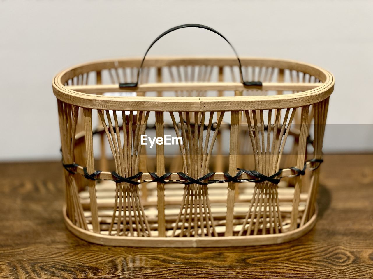 basket, container, indoors, no people, table, wood, food and drink, wicker, lighting