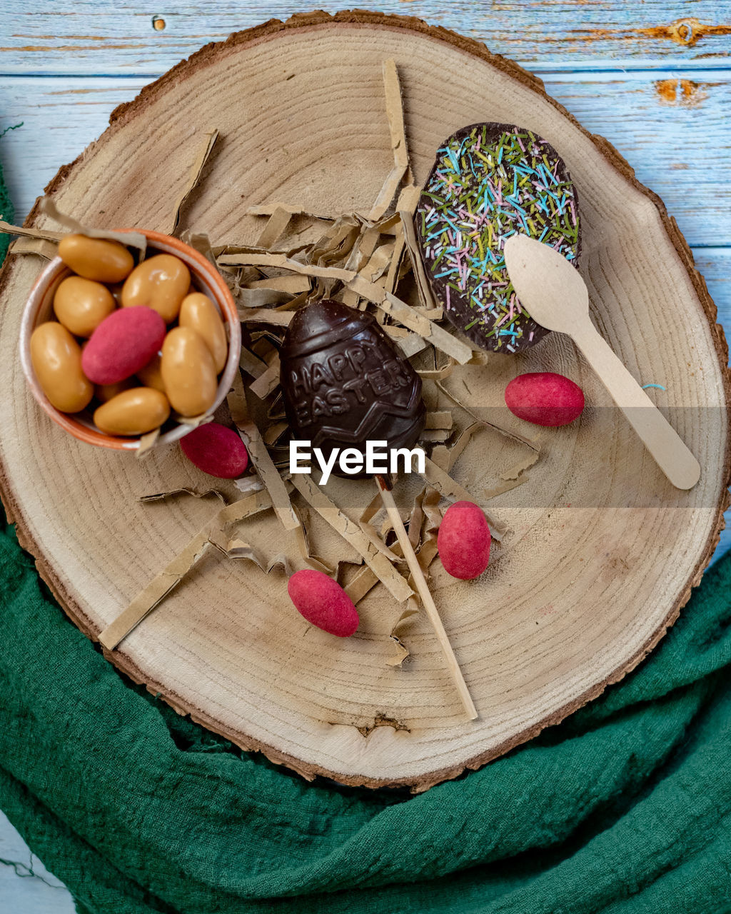 High angle view of easter candies in basket on table