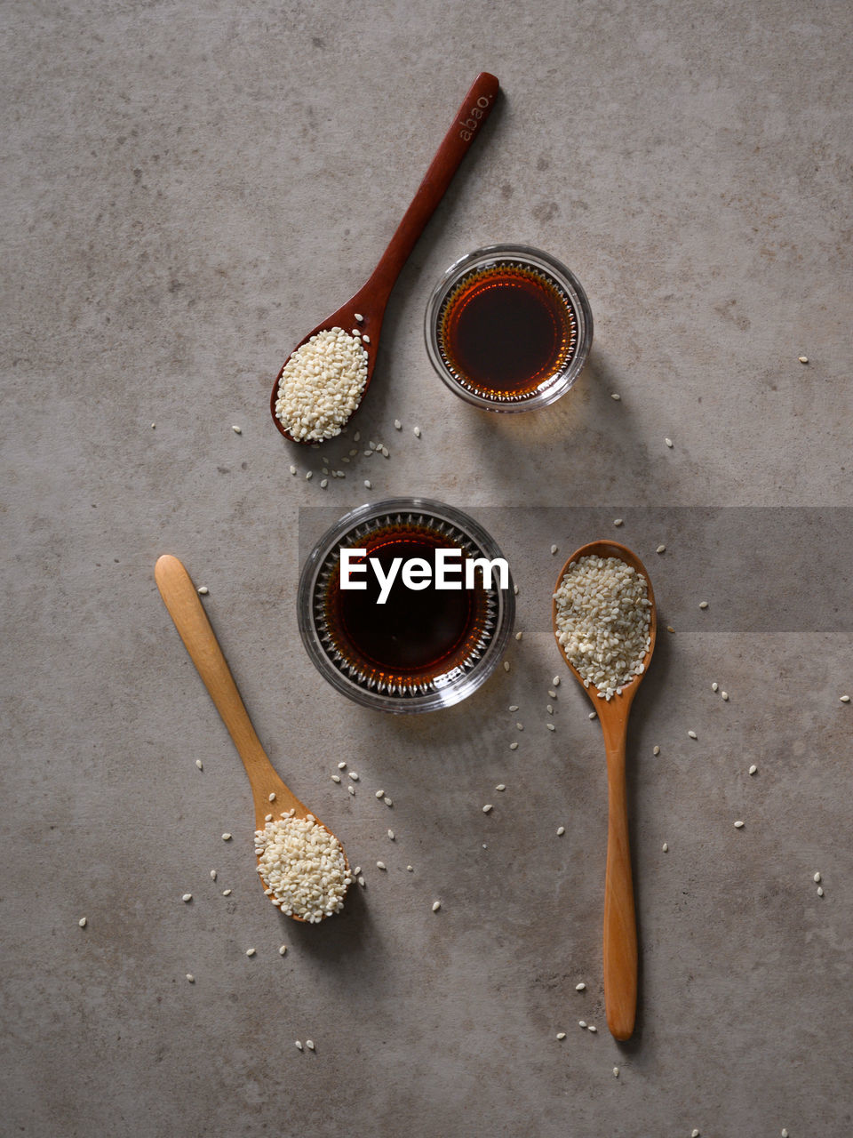 High angle view of sesame seed and sesame oil on table