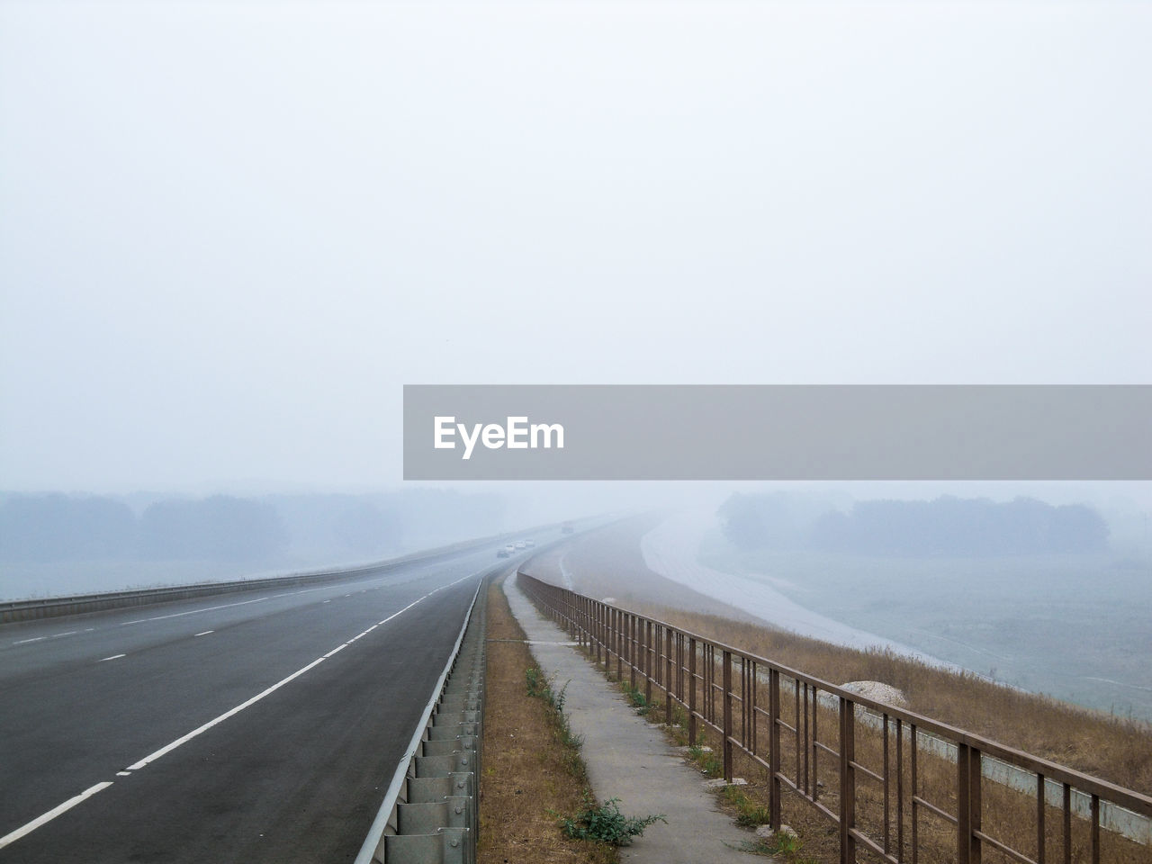 VIEW OF ROAD ON FOGGY DAY