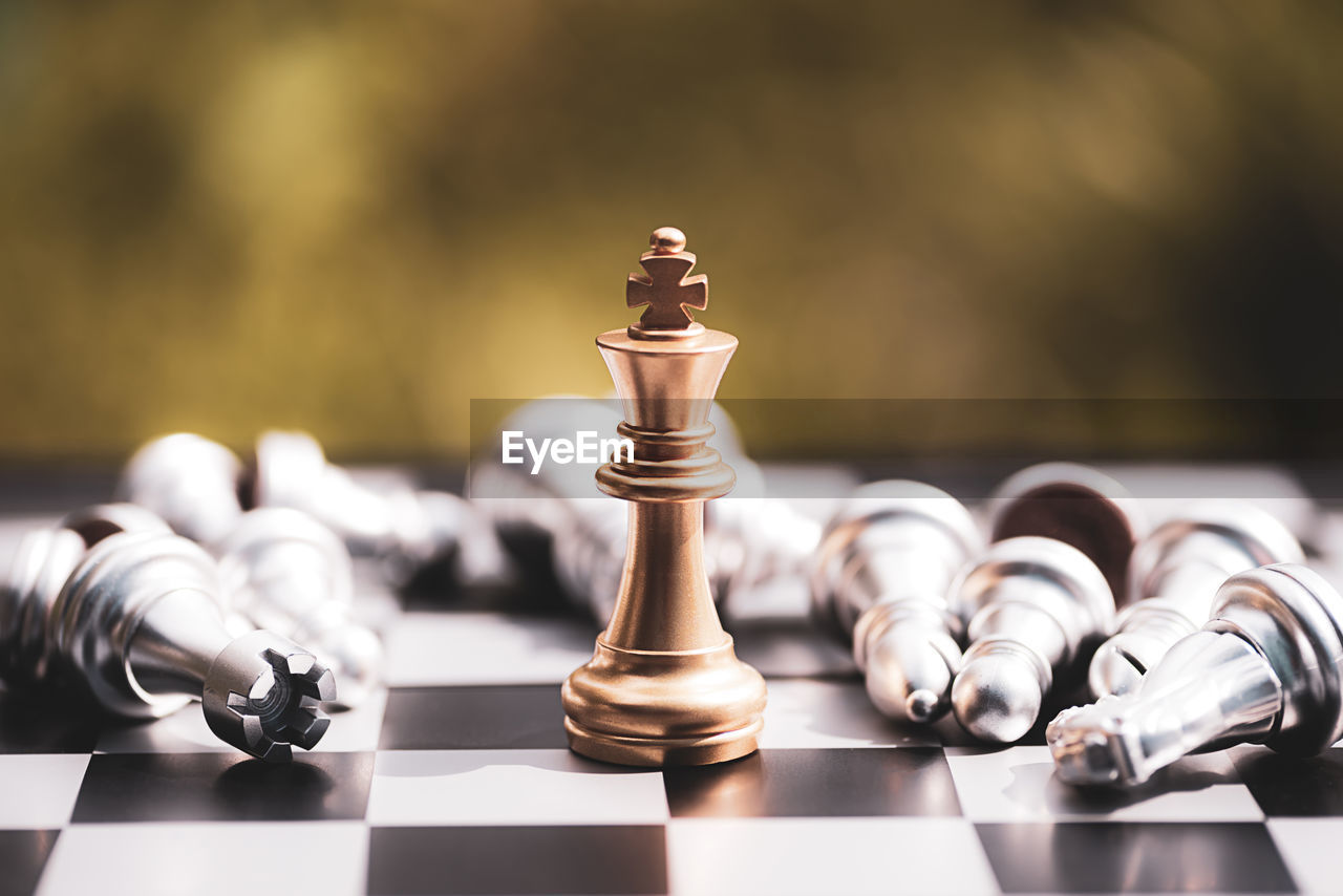 close-up of chess pieces against black background