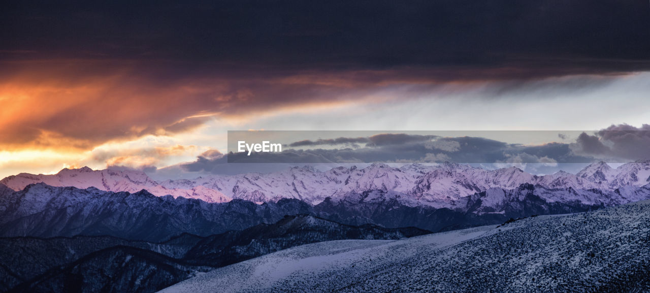 Panoramic view of mountains against dramatic sky
