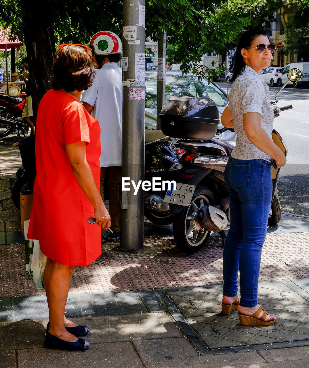 FULL LENGTH REAR VIEW OF WOMAN STANDING ON STREET