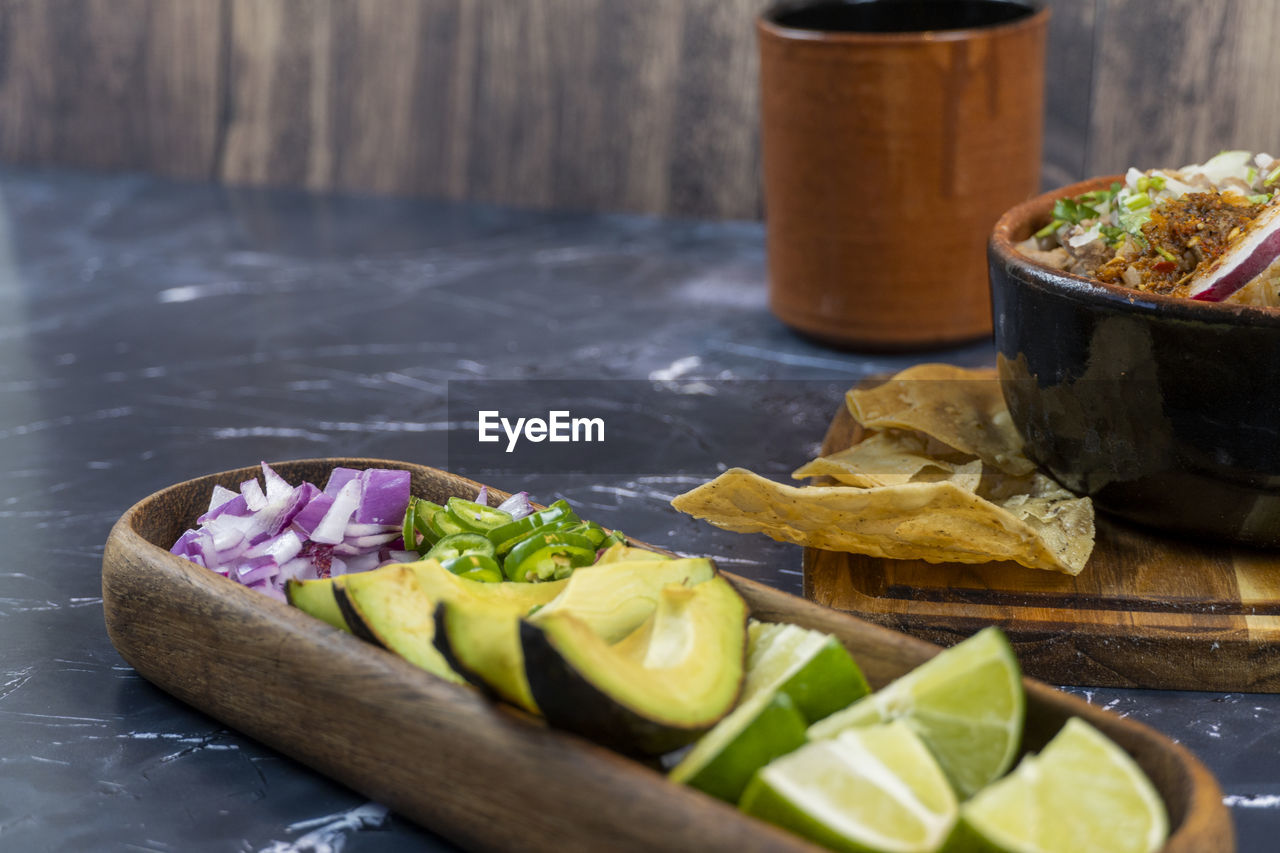 food and drink, food, healthy eating, dish, freshness, vegetable, wellbeing, fruit, meal, no people, produce, wood, citrus fruit, lemon, slice, lime, indoors, cuisine, still life, studio shot