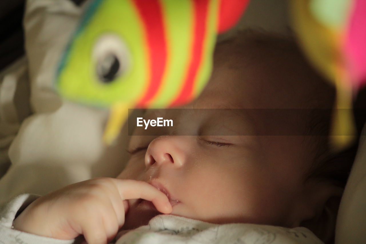 Close-up of cute baby boy sleeping