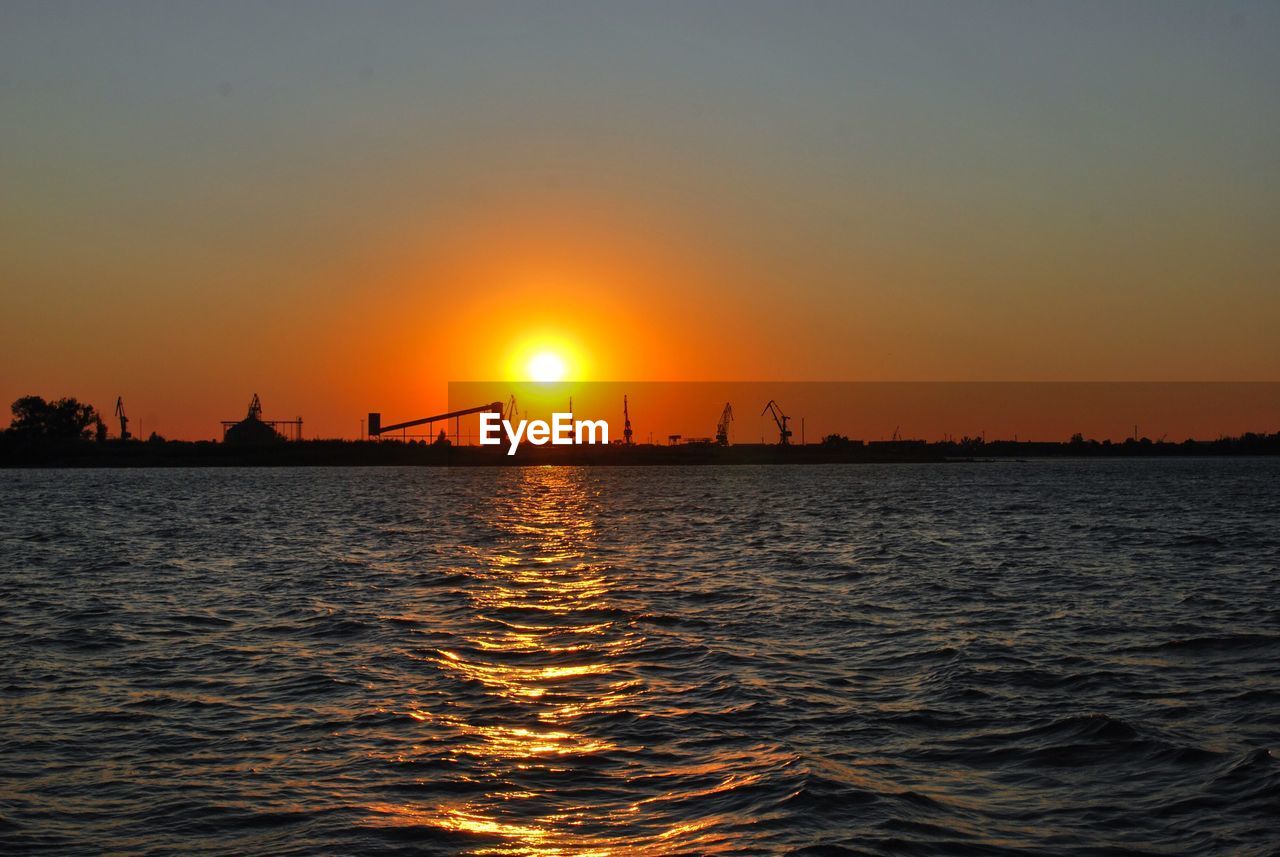 SILHOUETTE OF CITY DURING SUNSET