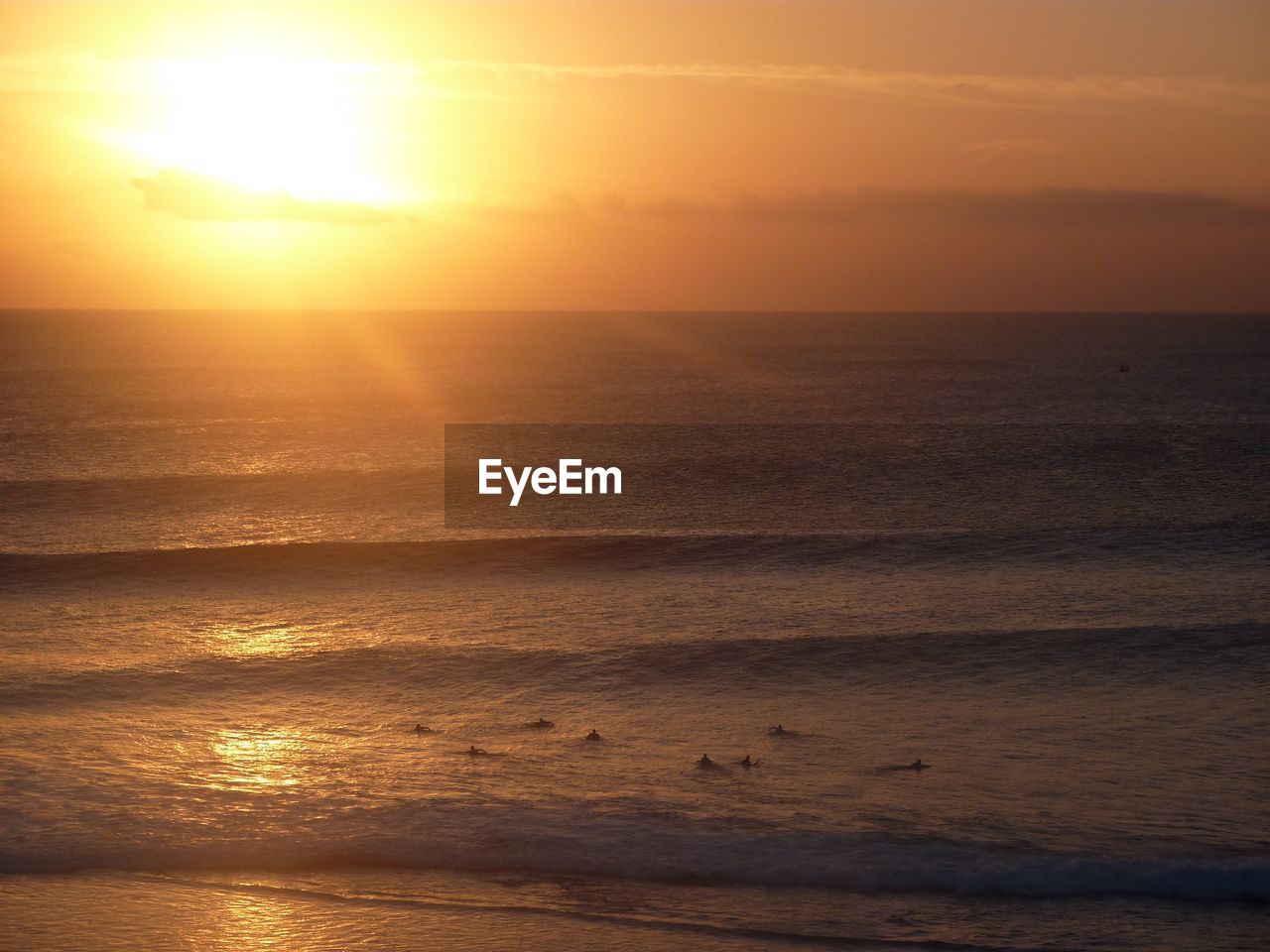 Scenic view of sea against orange sky during sunset