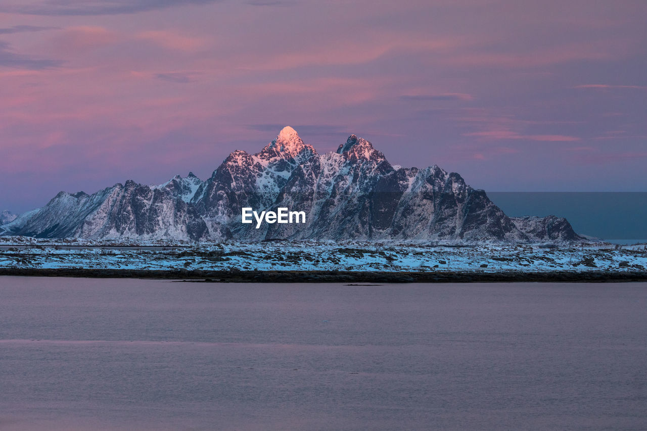 Scenic view of lofoten archipelago against sky during sunset