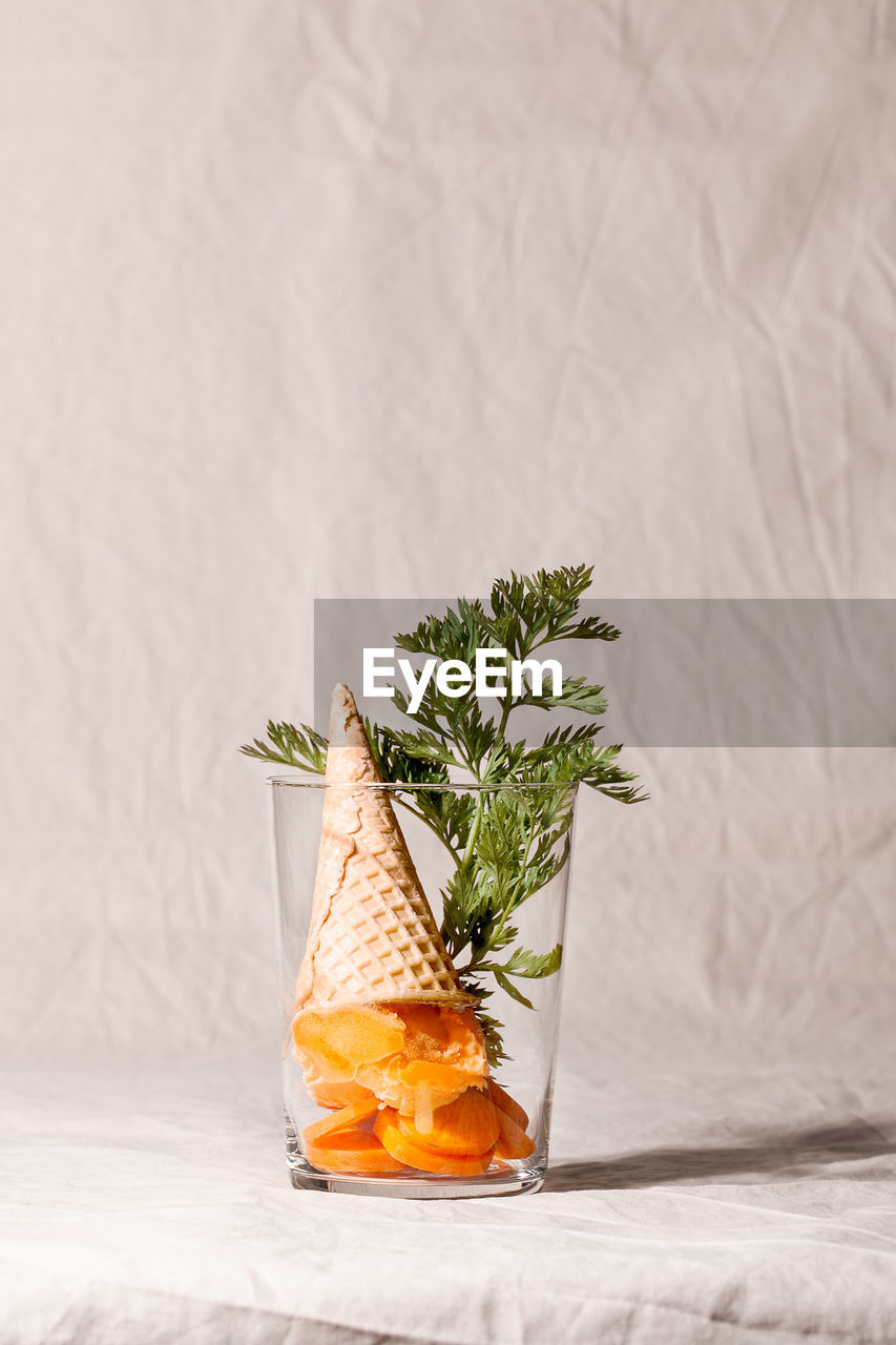 CLOSE-UP OF FOOD IN GLASS ON TABLE