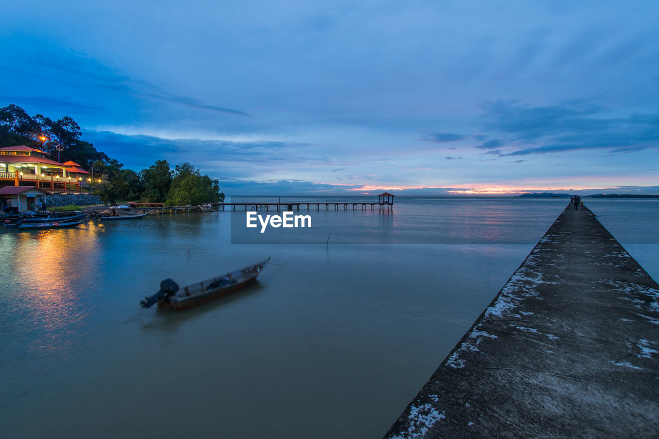 Scenic view of calm sea at sunset