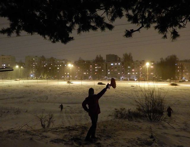 WOMAN STANDING AT NIGHT