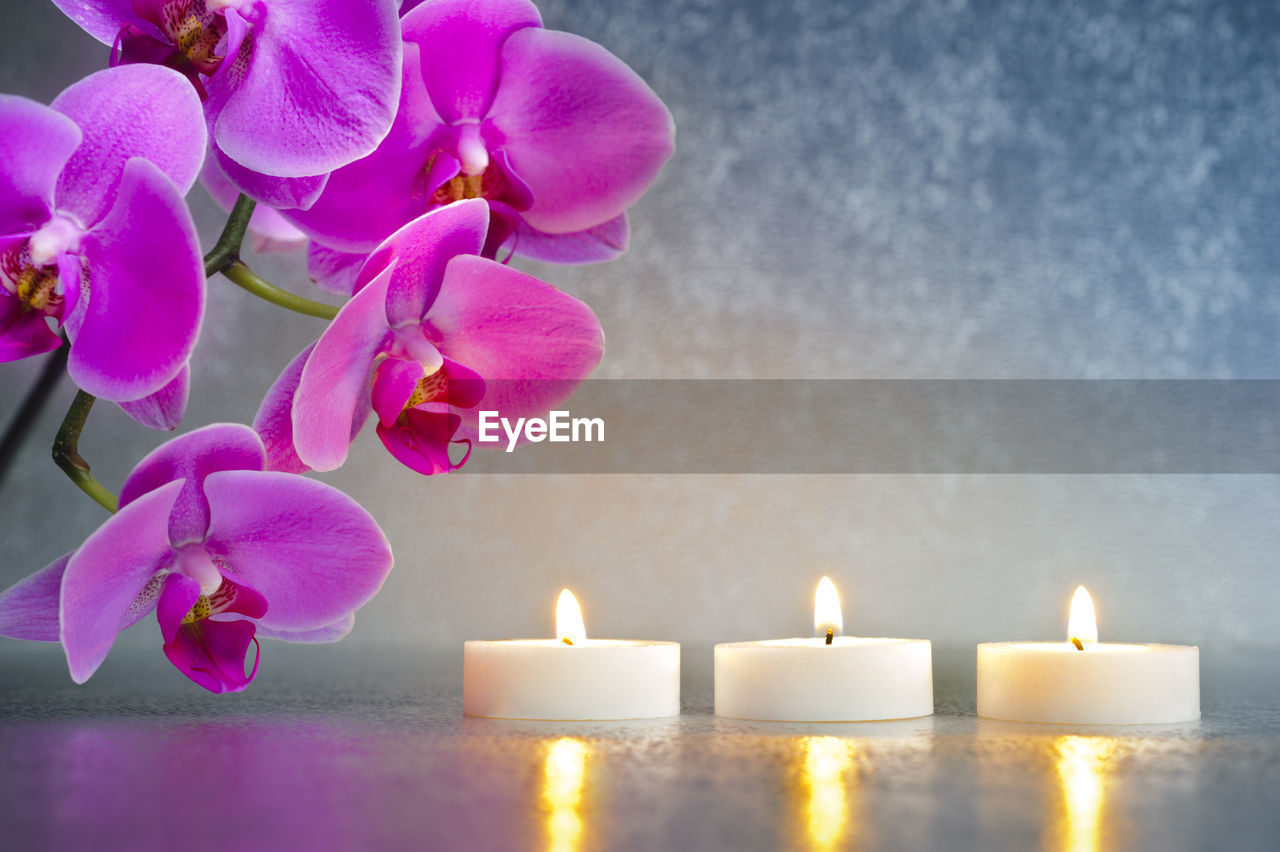 Japanese zen garden with candlelights and stacked stones