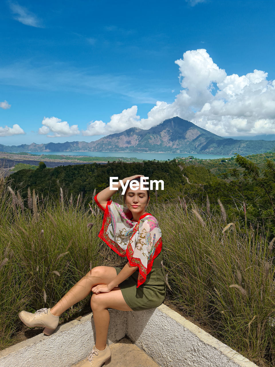 A woman, lake and mountain