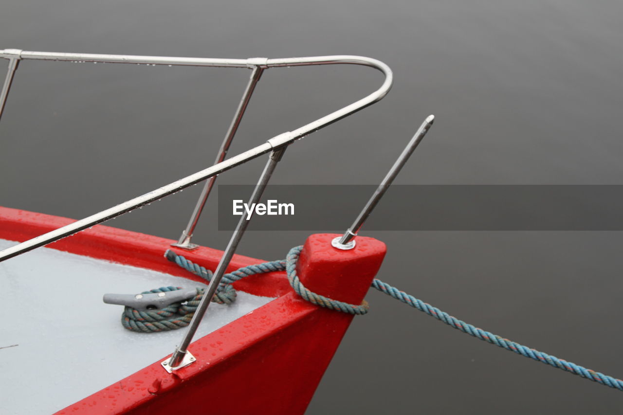 Close-up of rope tied on boat in sea