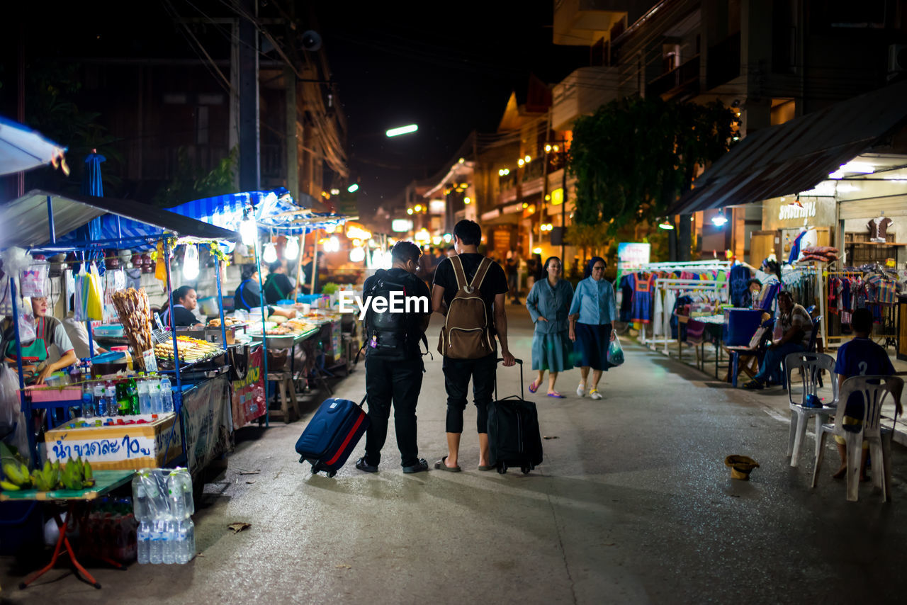 PEOPLE AT MARKET STALL