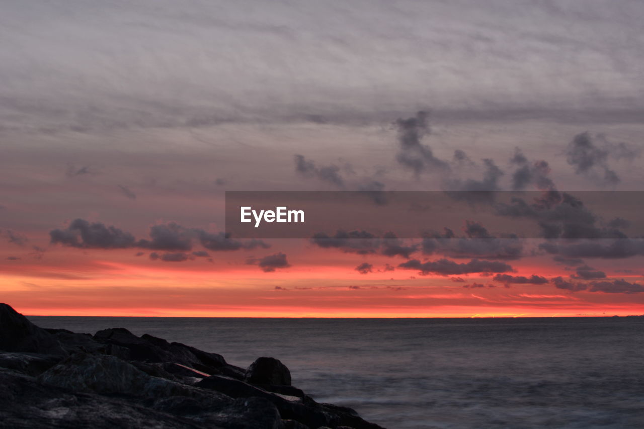 Scenic view of sea against sky during sunset