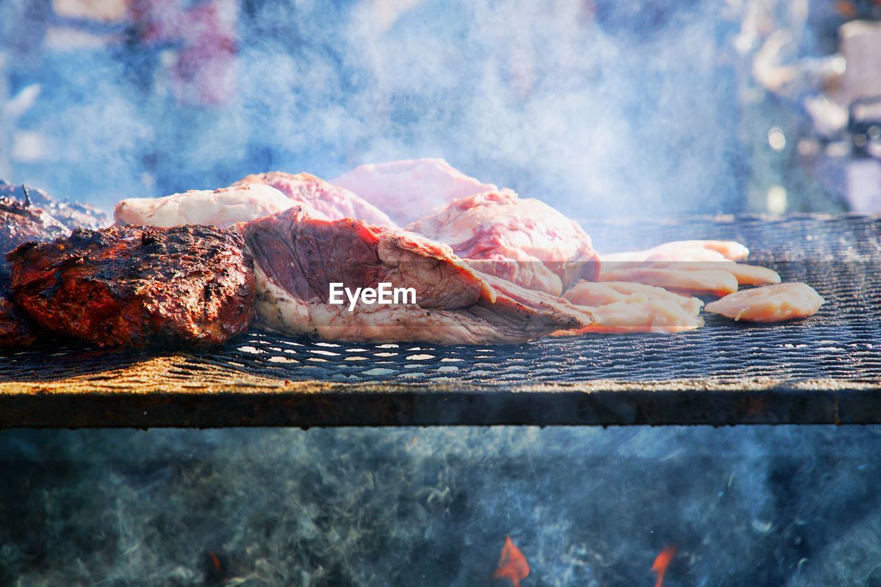 Close-up of meat on barbecue grill